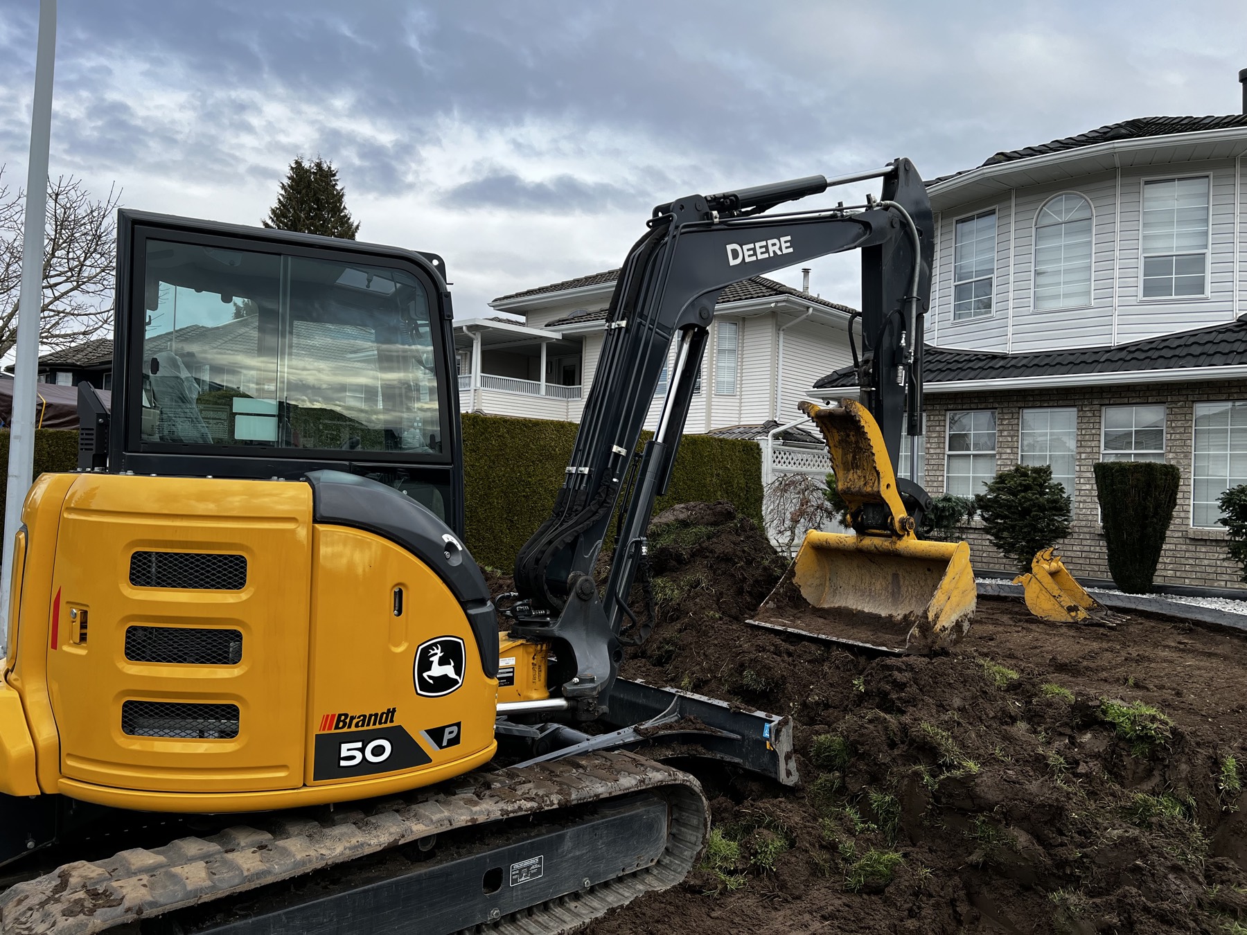 An SKS excavator working on a residential lot