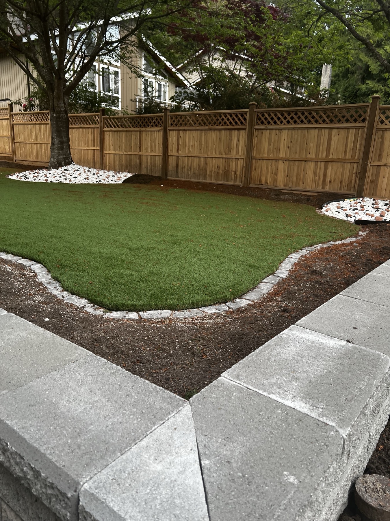 A finished lawn with paver edging