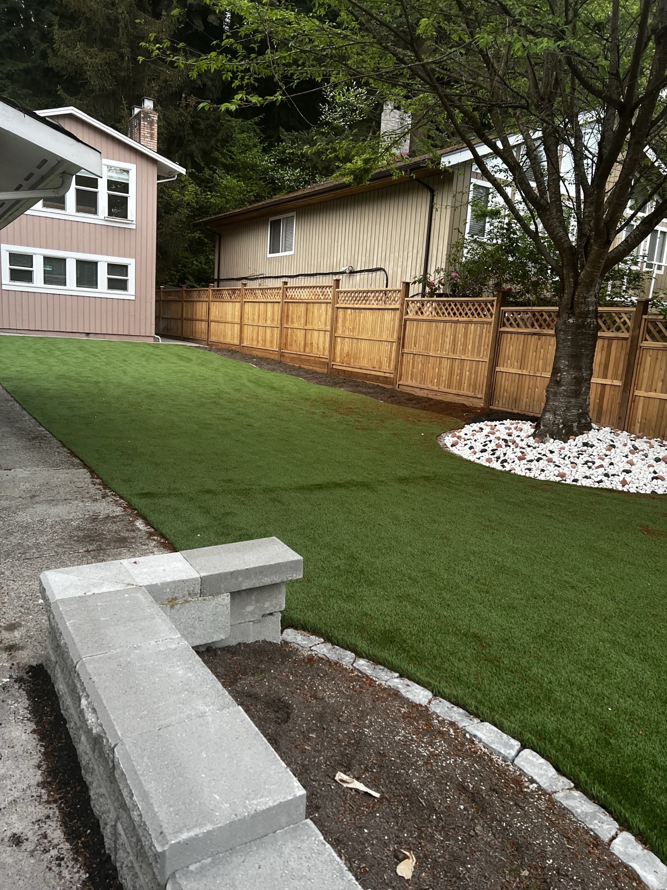 A finished lawn and retaining wall