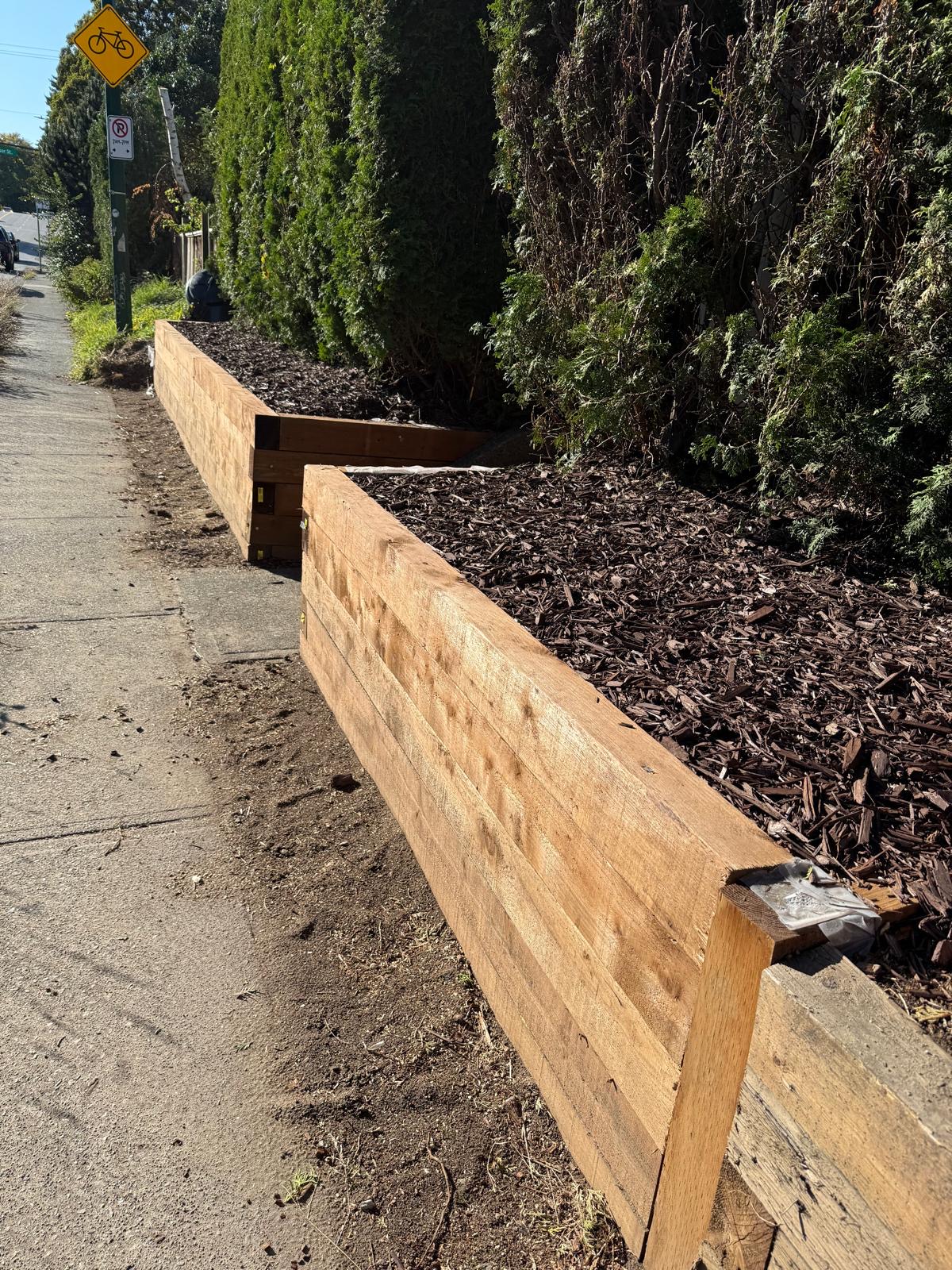 A timber retaining wall and planted bed