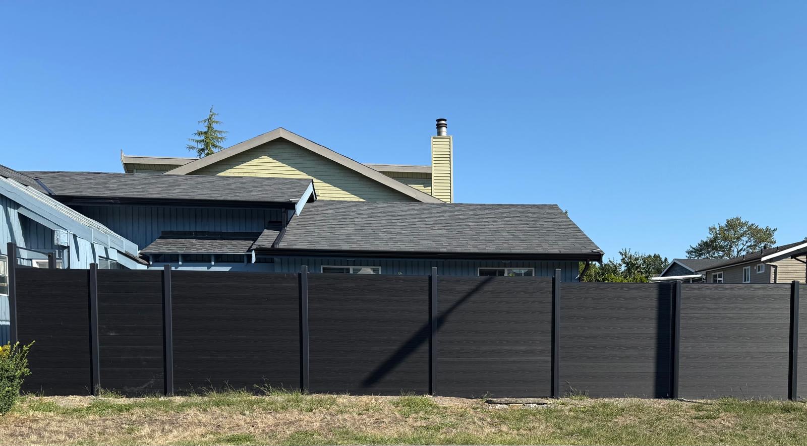 A dark metal fence run