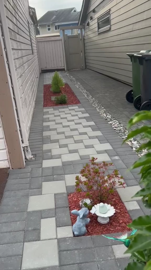 A paver path beside a house