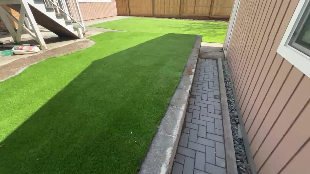 A finished lawn, paver path and edging
